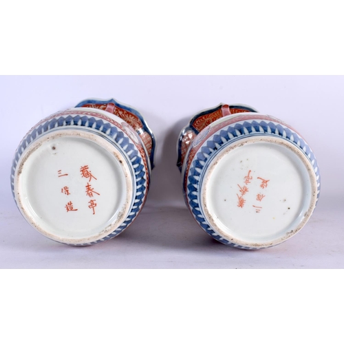 2089 - A PAIR OF 19TH CENTURY JAPANESE MEIJI PERIOD TWIN HANDLED IMARI VASE painted with foliage. 26 cm x 1... 