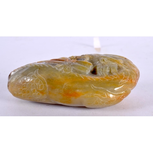 2103 - A CHINESE CARVED JADE PEBBLE 20th Century. 10.5 cm x 5.5 cm.