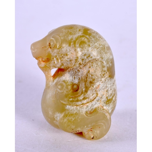 2105 - A CHINESE CARVED MUTTON JADE BEAST 20th Century. 4 cm x 2.75 cm.