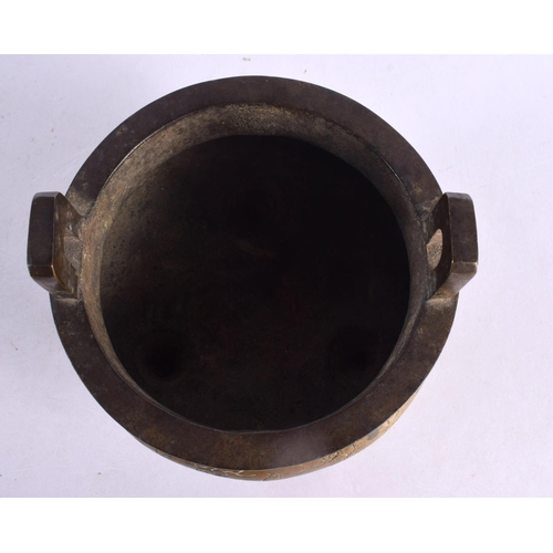 2160 - A 19TH CENTURY CHINESE TWIN HANDLED BRONZE CENSER bearing Xuande marks to base. 15 cm x 13 cm.