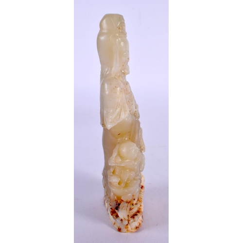 2184 - A CHINESE CARVED GREEN JADE FIGURE OF A STANDING DEITY 20th Century. 15 cm x 5 cm.