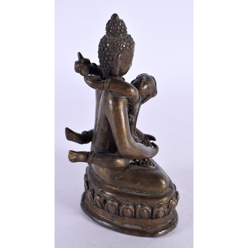 2188 - A 19TH CENTURY INDIAN SOUTH EAST ASIAN BRONZE FIGURE OF AN EROTIC DEITY modelled as a buddha. 11.75 ... 