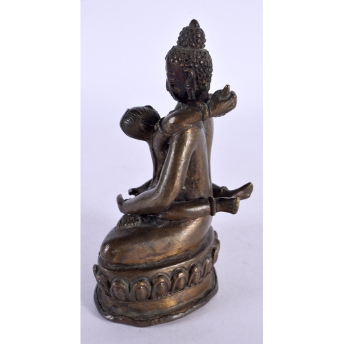 2188 - A 19TH CENTURY INDIAN SOUTH EAST ASIAN BRONZE FIGURE OF AN EROTIC DEITY modelled as a buddha. 11.75 ... 