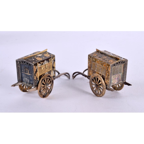 2190 - A PAIR OF JAPANESE TAISHO PERIOD SILVER MIXED METAL RICKSHAW CONDIMENTS. 45 grams. 6.5 cm x 3.75 cm.