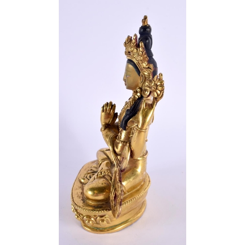 2216 - A 19TH/20TH CENTURY CHINESE TIBETAN GILT BRONZE BUDDHA modelled with clasped hands. 15 cm x 8 cm.