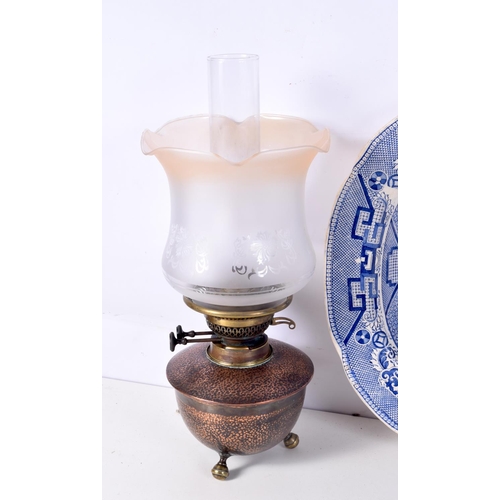 3713 - A collection of Oil lamps together with a ceramic platter.51 x 41 cm. (3).