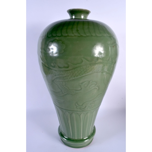 1862 - A LARGE CHINESE QING DYNASTY CELADON STONEWARE VASE decorated in relief with dragons. 45 cm x 18 cm.