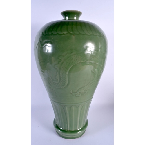 1862 - A LARGE CHINESE QING DYNASTY CELADON STONEWARE VASE decorated in relief with dragons. 45 cm x 18 cm.