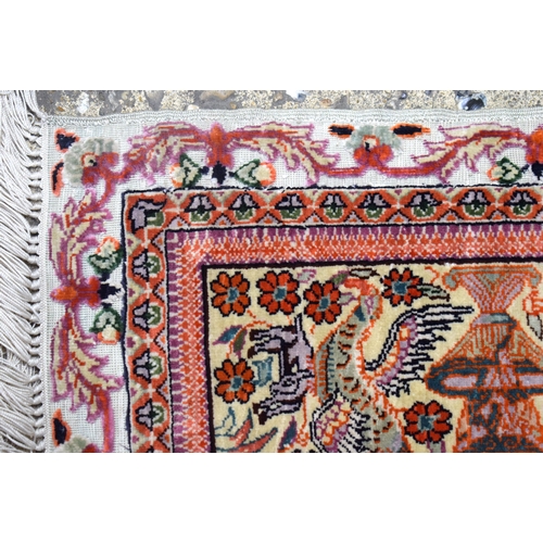 3839 - A small Islamic silk rug 122 x 77 cm .