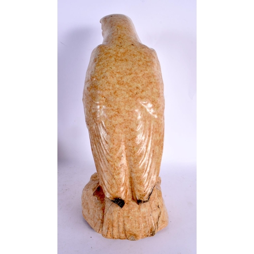 109 - AN UNUSUAL EARLY 20TH CENTURY ENGLISH STONEWARE FIGURE OF HAWK. 34 cm x 14 cm.