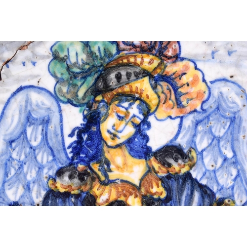 12 - A RARE 18TH CENTURY EUROPEAN FAIENCE TIN GLAZED SQUARE TILE painted with a winged female holding fis... 