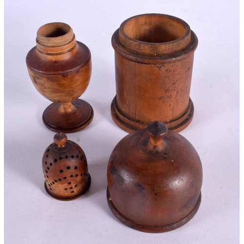 128 - AN ANTIQUE TREEN CARVED WOOD PEPPER POT together with a similar box and cover. Largest 16 cm high. (... 