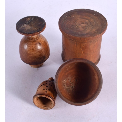 128 - AN ANTIQUE TREEN CARVED WOOD PEPPER POT together with a similar box and cover. Largest 16 cm high. (... 