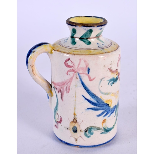 134 - A SMALL 19TH CENTURY ITALIAN FAIENCE GLAZED MINIATURE JUG Levantino family, painted with mythical cr... 