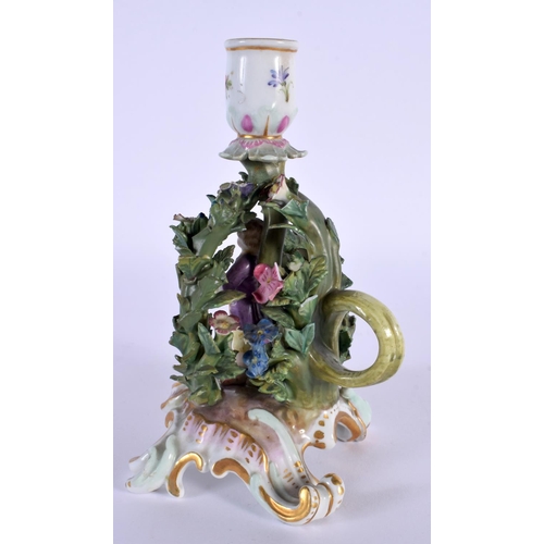 148 - A VERY RARE 19TH CENTURY MEISSEN PORCELAIN CHAMBERSTICK formed as a standing figure under foliage. 1... 