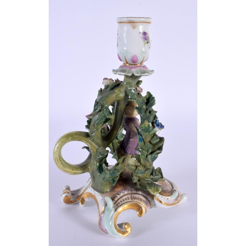 148 - A VERY RARE 19TH CENTURY MEISSEN PORCELAIN CHAMBERSTICK formed as a standing figure under foliage. 1... 