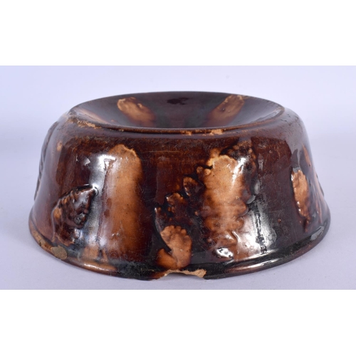 157 - A RARE EARLY 19TH CENTURY TREACLE GLAZED POTTERY SPITTOON. 16 cm wide.