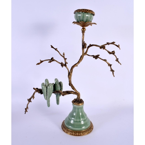 158 - AN UNUSUAL CONTINENTAL CELADON GLAZED COUNTRY HOUSE BRONZE CANDLESTICK overlaid with birds. 34 cm x ... 