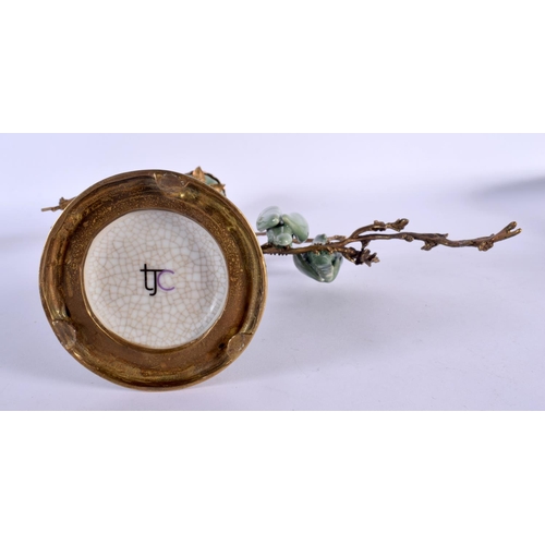 158 - AN UNUSUAL CONTINENTAL CELADON GLAZED COUNTRY HOUSE BRONZE CANDLESTICK overlaid with birds. 34 cm x ... 