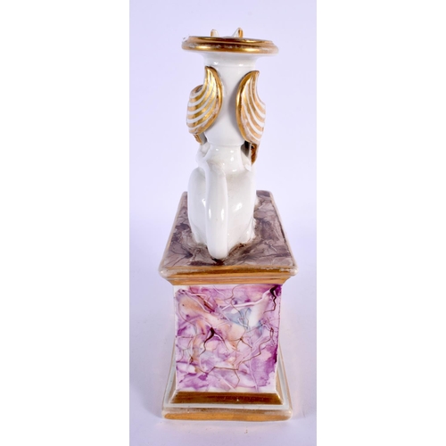 173 - 19th century English porcelain candlestick in the form of a griffin seated on a plinth, the plinth h... 