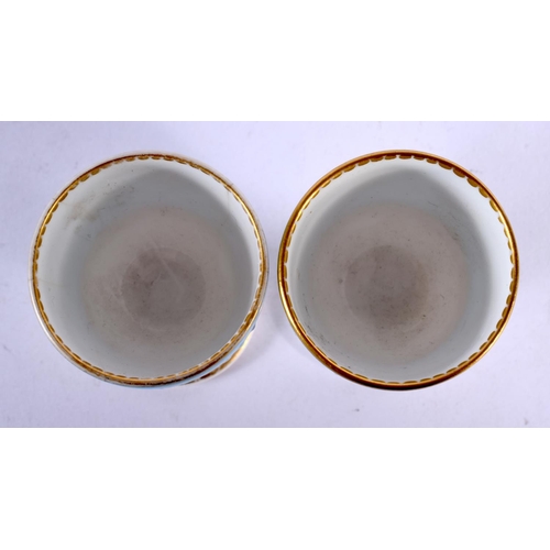 252 - Royal Worcester pair of egg cups decorated after Sir Christopher Dresser with a typical style on a t... 