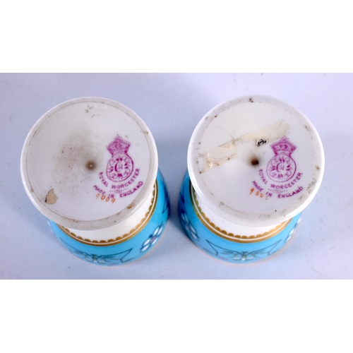 252 - Royal Worcester pair of egg cups decorated after Sir Christopher Dresser with a typical style on a t... 