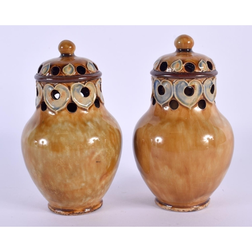 292 - A PAIR OF ROYAL DOULTON STONEWARE PEPPERETTES. 12 cm high.