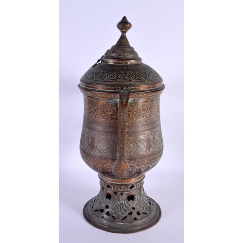 293 - A LARGE ANTIQUE MIDDLE EASTERN COPPER ALLOY TEA URN with pierced base. 43 cm x 22 cm.