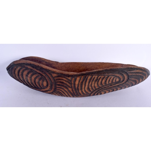302 - A VINTAGE ABORIGINAL TRIBAL CARVED WOOD FOOD SCOOP decorated all over with motifs. 22 cm x 10 cm.