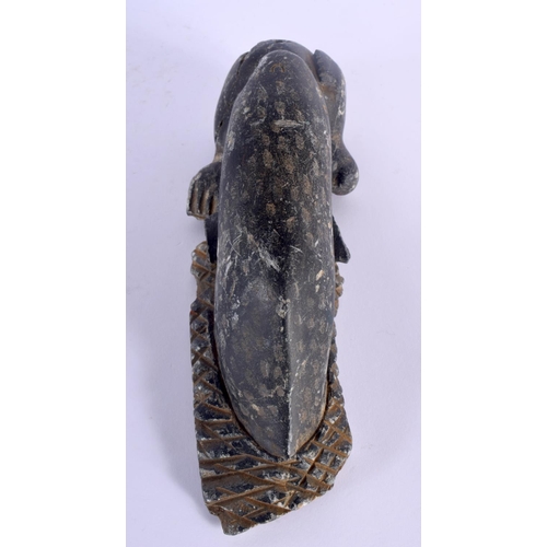 303 - AN UNUSUAL EARLY NORTH AMERICAN INUIT CARVED STONE FIGURE modelled as a whale attacking a sea lion. ... 