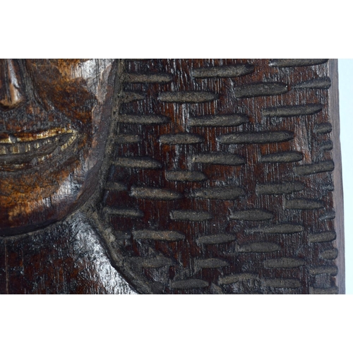 304 - AN UNUSUAL VINTAGE TRIBAL CARVED WOOD M?ORI ABORIGINAL PANEL depicting a nude female. 21 cm x 14 cm.