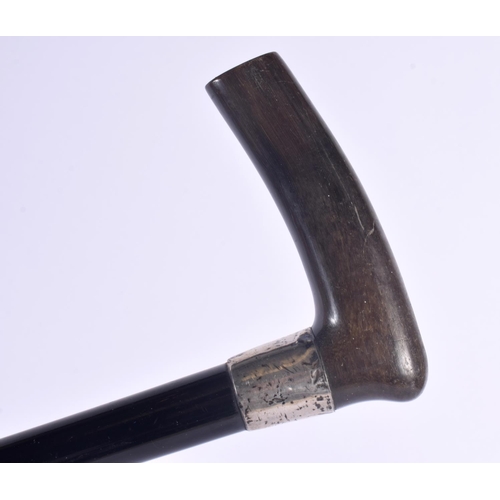 307 - AN ANTIQUE SILVER MOUNTED RHINOCEROS HORN HANDLED WALKING CANE. London 1911. 90 cm long.