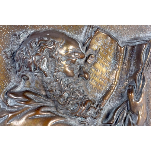 310 - AN 18TH/19TH CENTURY EUROPEAN BRONZE PLAQUE depicting a scholar reading a book. 20 cm x 16 cm.