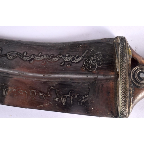 317 - AN ANTIQUE MIDDLE EASTERN YEMENI OMANI CARVED RHINOCEROS HORN JAMBIYA DAGGER with matching belt stra... 