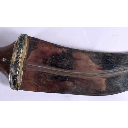 317 - AN ANTIQUE MIDDLE EASTERN YEMENI OMANI CARVED RHINOCEROS HORN JAMBIYA DAGGER with matching belt stra... 