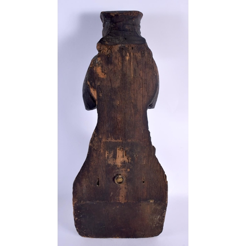 321 - A LARGE 18TH/19TH CENTURY EUROPEAN CARVED WOOD FIGURE OF A SAINT modelled seated upon a stump. 52 cm... 