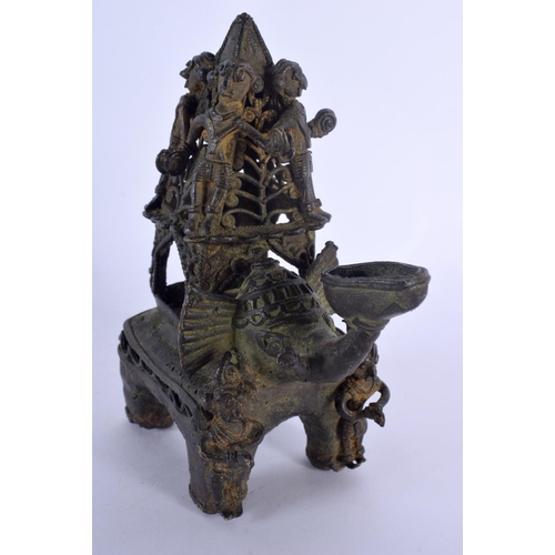323 - A 19TH CENTURY TRIBAL BENIN BRONZE FIGURE OF AN ELEPHANT modelled with numerous figures on board. 15... 