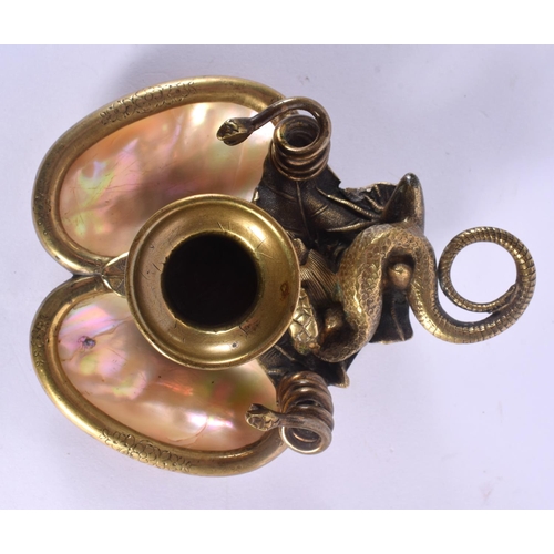 324 - A LOVELY 19TH CENTURY FRENCH PALAIS ROYALE BRONZE AND MOTHER OF PEARL CHAMBERSTICK formed with a coi... 