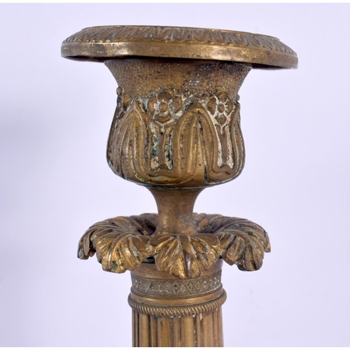 331 - A PAIR OF 19TH CENTURY FRENCH GILT BRONZE EMPIRE CANDLESTICKS with acanthus capped stems, supported ... 