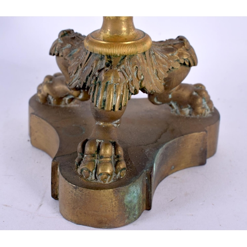 331 - A PAIR OF 19TH CENTURY FRENCH GILT BRONZE EMPIRE CANDLESTICKS with acanthus capped stems, supported ... 