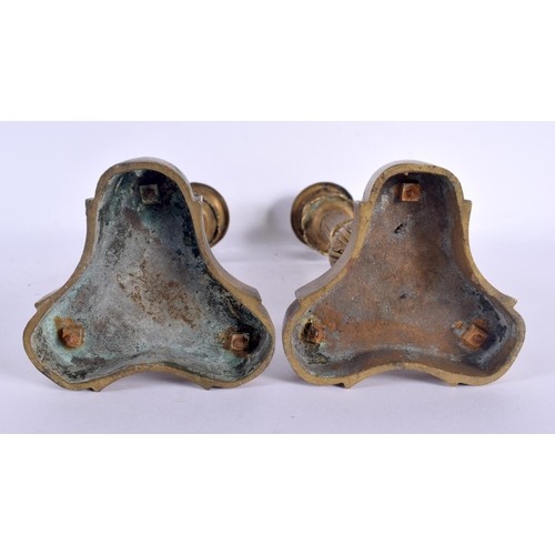 331 - A PAIR OF 19TH CENTURY FRENCH GILT BRONZE EMPIRE CANDLESTICKS with acanthus capped stems, supported ... 