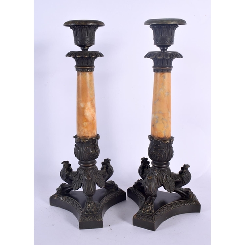 332 - A PAIR OF 19TH CENTURY FRENCH BRONZE AND SIENNA MARBLE EMPIRE CANDLESTICKS formed upon acanthus capp... 