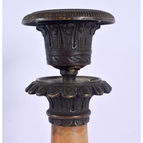 332 - A PAIR OF 19TH CENTURY FRENCH BRONZE AND SIENNA MARBLE EMPIRE CANDLESTICKS formed upon acanthus capp... 