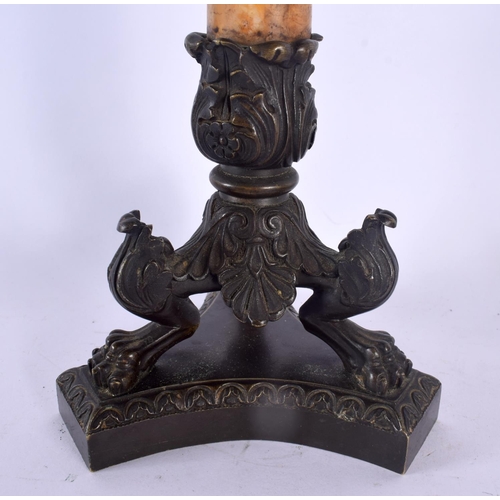 332 - A PAIR OF 19TH CENTURY FRENCH BRONZE AND SIENNA MARBLE EMPIRE CANDLESTICKS formed upon acanthus capp... 