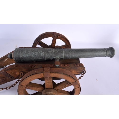 343 - THREE VINTAGE COUNTRY HOUSE CANNONS in various forms and sizes. Largest 55 cm x 20 cm. (3)