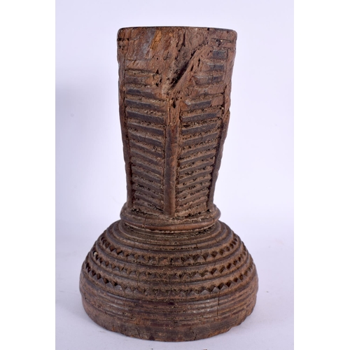 344 - AN UNUSUAL TRIBAL INDIAN CARVED WOOD STAND decorated with star crossed motifs. 16 cm x 14 cm.