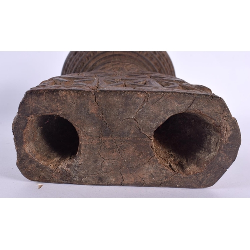 344 - AN UNUSUAL TRIBAL INDIAN CARVED WOOD STAND decorated with star crossed motifs. 16 cm x 14 cm.