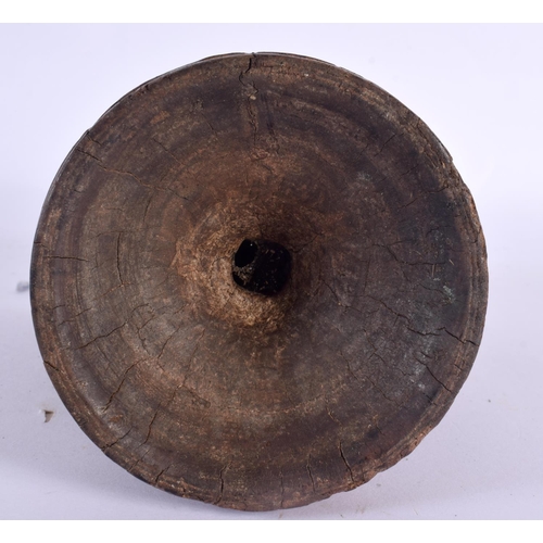 344 - AN UNUSUAL TRIBAL INDIAN CARVED WOOD STAND decorated with star crossed motifs. 16 cm x 14 cm.