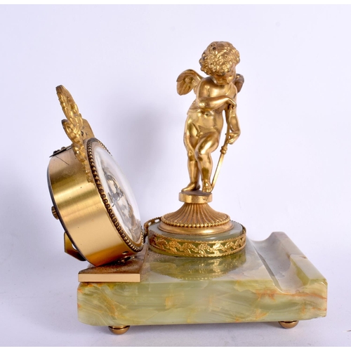 350 - AN ART DECO GILT BRONZE AND ONYX DESK CLOCK. 14 cm x 10 cm.