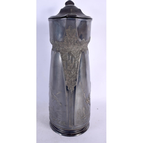 352 - A LARGE ART NOUVEAU ORIVIT PEWTER CLARET HUNTING JUG. 36 cm x 14 cm.